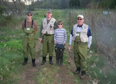 MITCHELL RIVER HOUSE with four people out for fishing