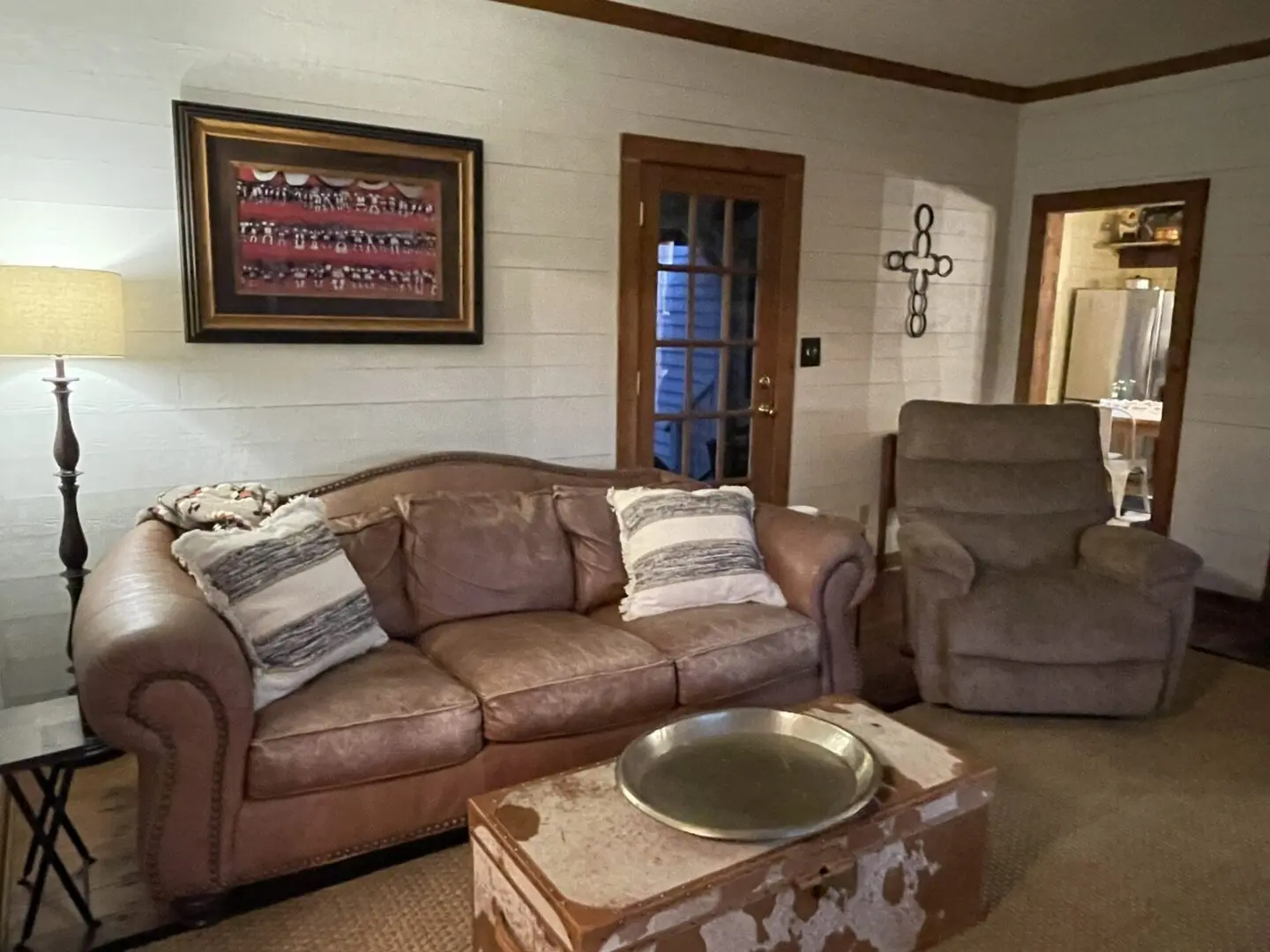 A living room with couches and a chair